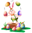 A bunny juggling the easter eggs vector image