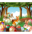 A group of bunnies and easter eggs vector image