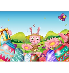 A bunny with a guitar and the easter eggs in the vector image