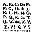 Alphabet and symbols from black brush strokes vector image