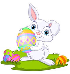 Cute easter bunny carrying egg vector image