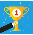 Business hand holding trophy cup vector image