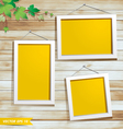 White photo frame on wood background vector image