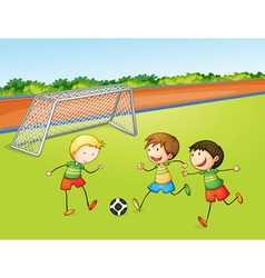 Boys playing football vector image