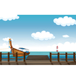 A docked boat and lighthouse vector image