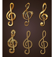 Set of golden decorative treble clef vector image