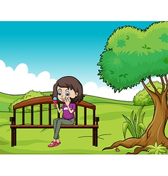 A young woman eating an ice cream vector image