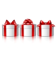 Three white gift boxes with a red bows vector image