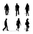 Men and women walking silhouettes vector image