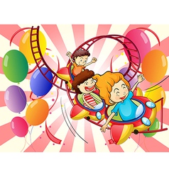 Kids enjoying the roller coaster ride vector image