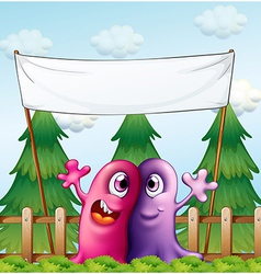 Two loving monsters under the empty banner vector image