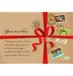 Christmas gift with red ribbon and vintage postage vector image
