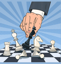 Pop art hand of businessman playing chess vector image