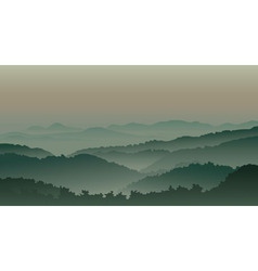 Green mountains in fog vector image