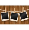 Photos hanging on a clothesline vector image