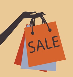 HAND HOLDING SHOPPING BAGS vector image