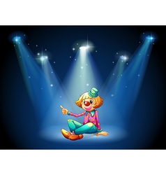 A stage with a female clown sitting at the center vector image