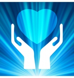 Heart in open hands vector image