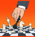 Pop art hand of businessman holding chess figure Pop art hand of businessman holding chess figure vector image