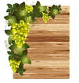White grapes on a wooden background vector image