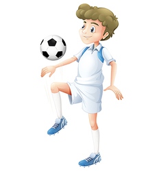 A tall boy playing soccer A tall boy playing soccer vector image