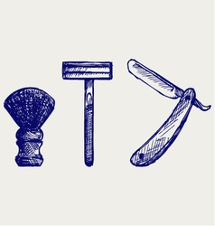 Straight razor and shaving brush vector image