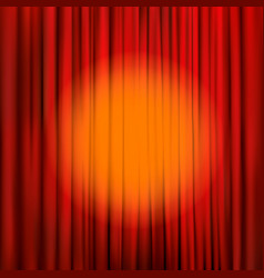 Spotlight on a red stage curtain vector image