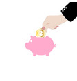 Man putting coin into the piggy money vector image