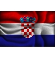 Crumpled flag of Croatia on a light background vector image