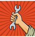 Raised Fist Holding Wrench vector image