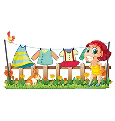 A woman hanging her clothes in the garden with a vector image