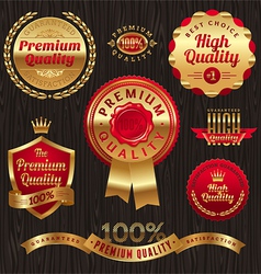 Set of golden quality labels and emblems vector image