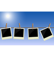 Four polaroid pictures hanging on rope vector image