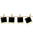 Four polaroid pictures hanging on rope vector image