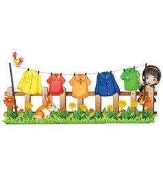 A lady hanging her clothes in the garden with a vector image