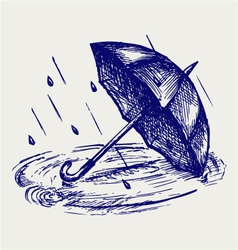 Rain drops rippling in puddle and umbrella vector image