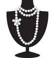 Pearl necklace on black mannequin vector image