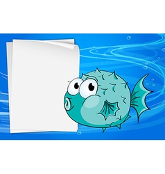 A fish beside a paper under the sea vector image