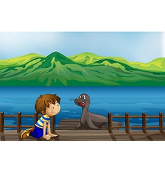 A boy and a sea lion vector image