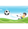 A boy playing football at the hills vector image