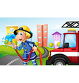 A fireman with a hose at the street vector image