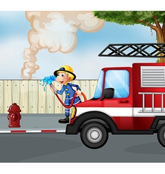 A fireman rescuing a fire near the street vector image