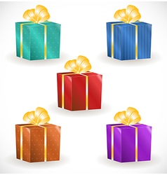 Gift boxes with gold ribbons vector image