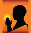 Black silhouette of a praying vector image