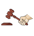Wooden gavel in hand vector image