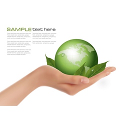 Human hand holding green globe vector image