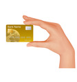 Hand with gold credit card vector image