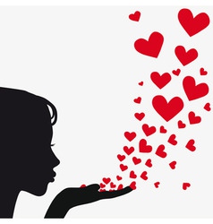 Silhouette woman blowing heart vector image