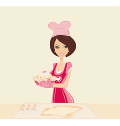 Beautiful young Housewife cooking cake vector image